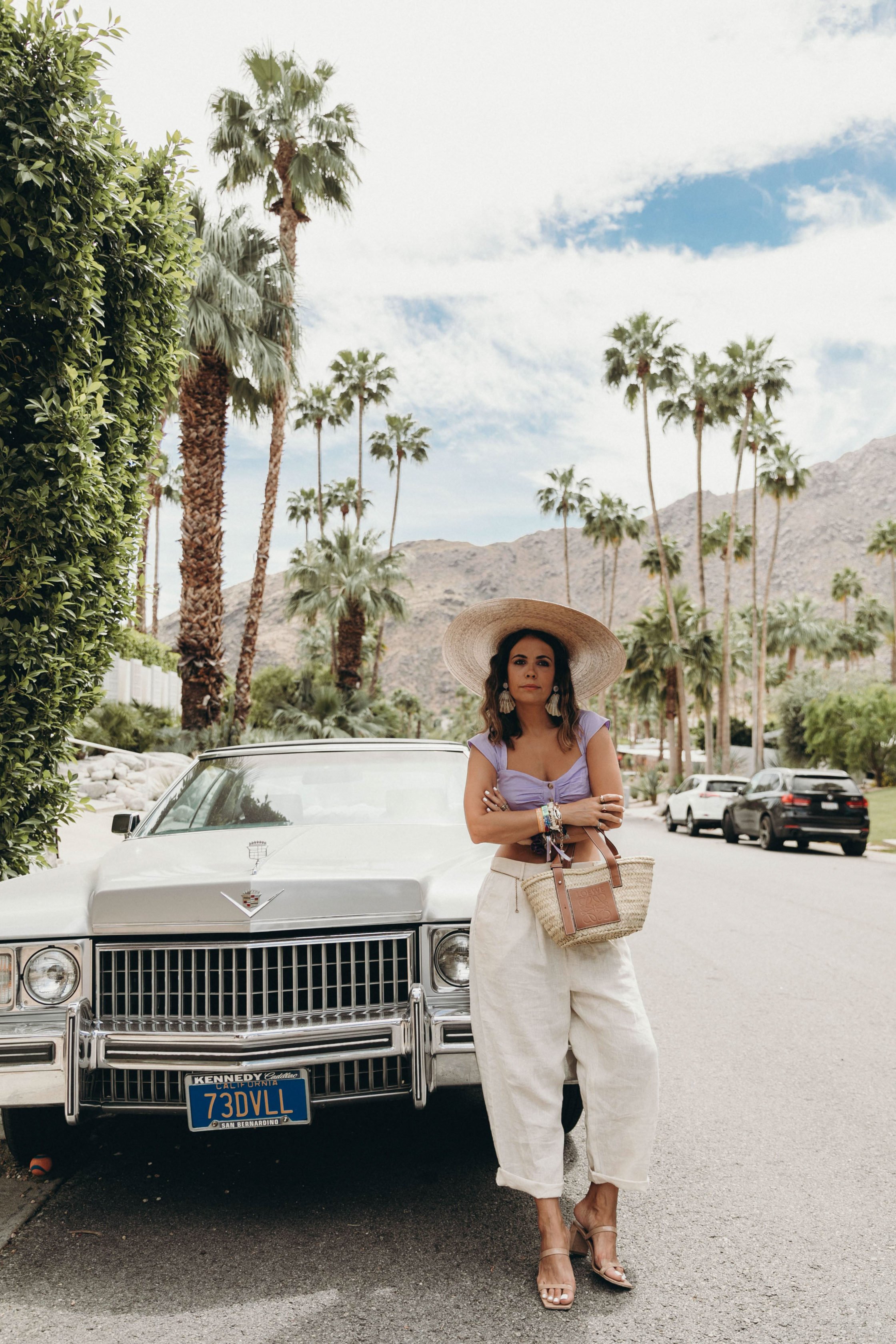 Sara of Collage Vintage wearing a LPA lilac top and baggy pants for attending Coachella 2019