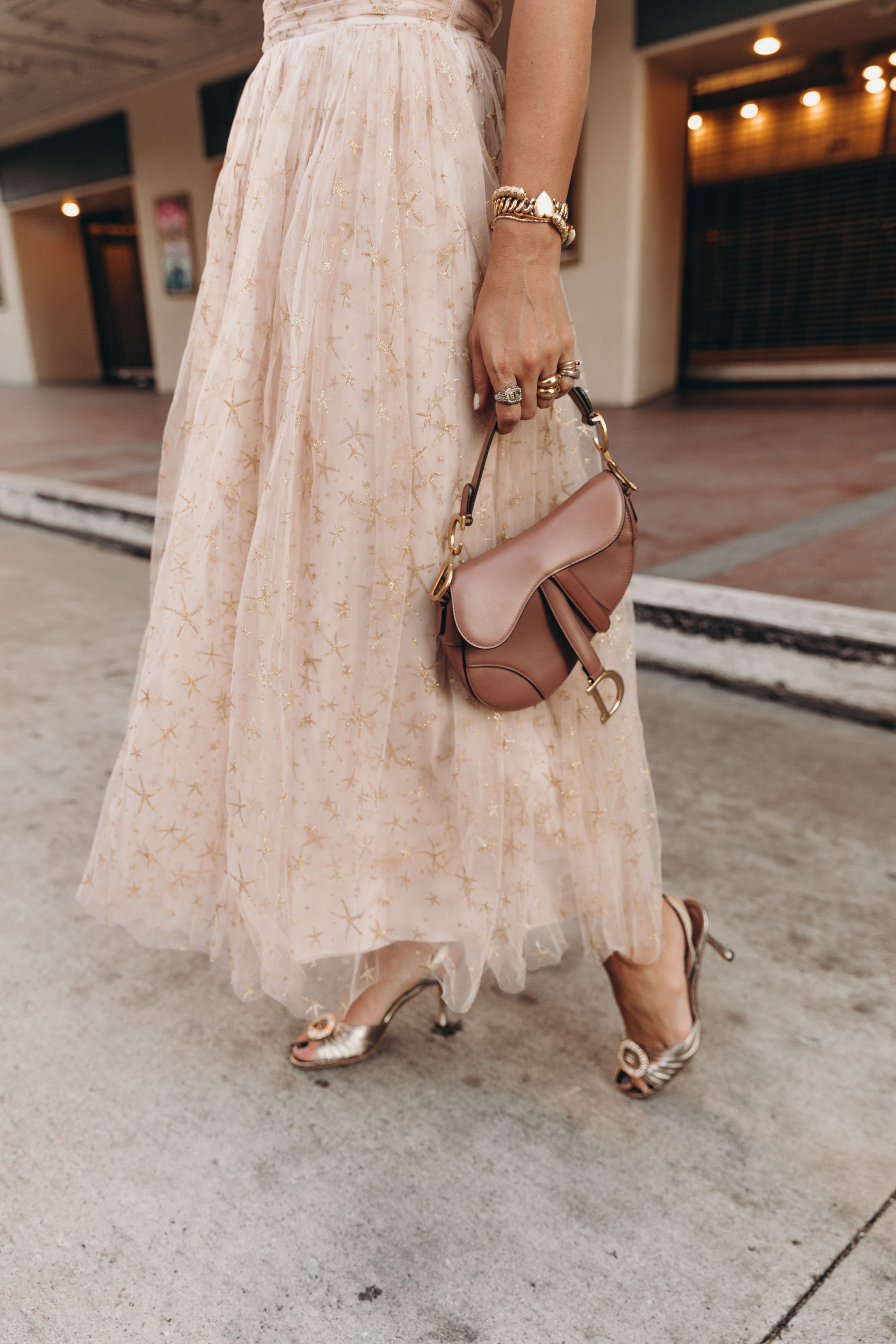 Party outfit wearing a Champagne tulle dress and Manolo Blahnik sandals