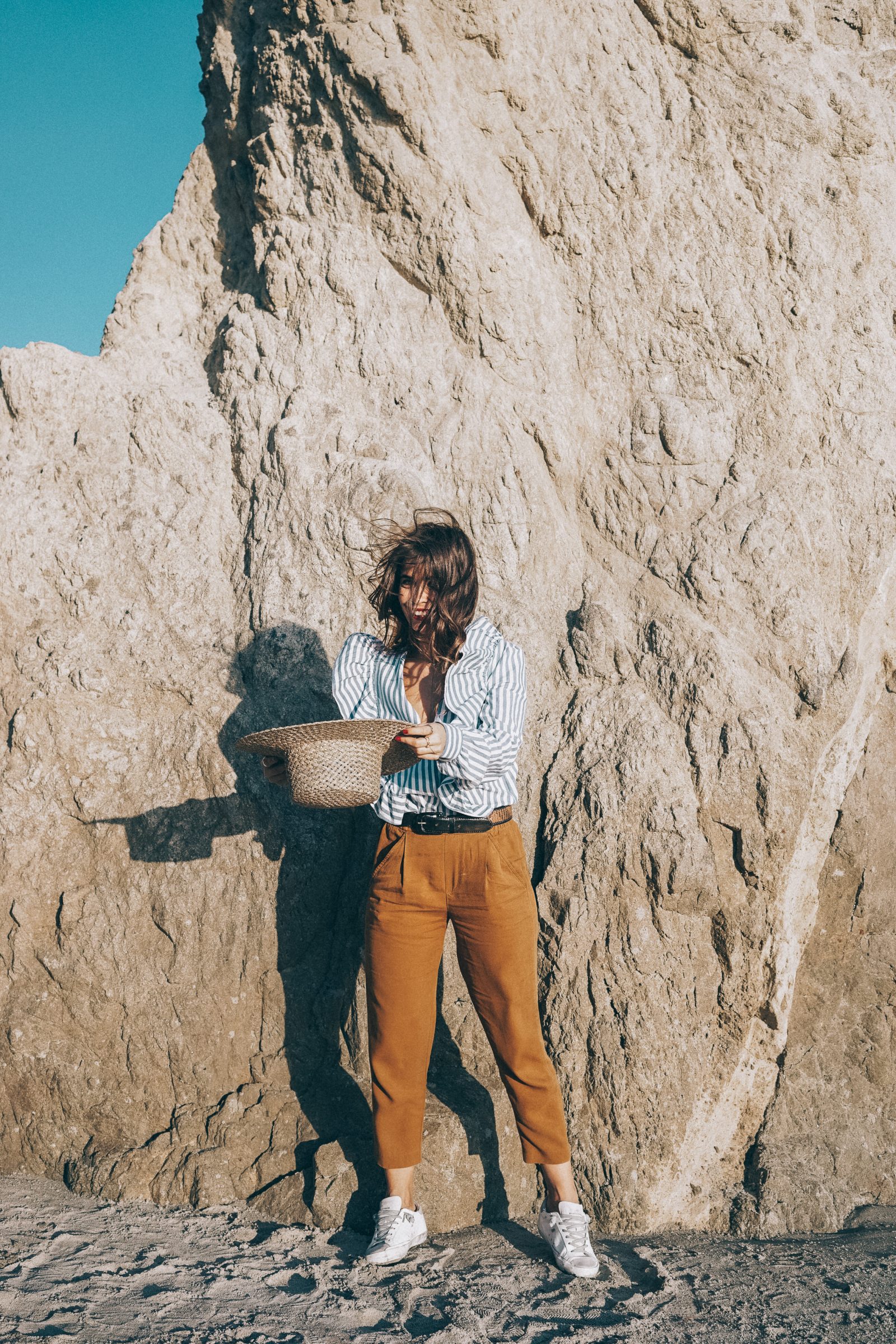 stripped_blouse-camel_trousers-lack_of_color_hat-wanderlust_jewels-matador_beach-malibu-golden_goose_sneakers-street_style-collage_vintage-107
