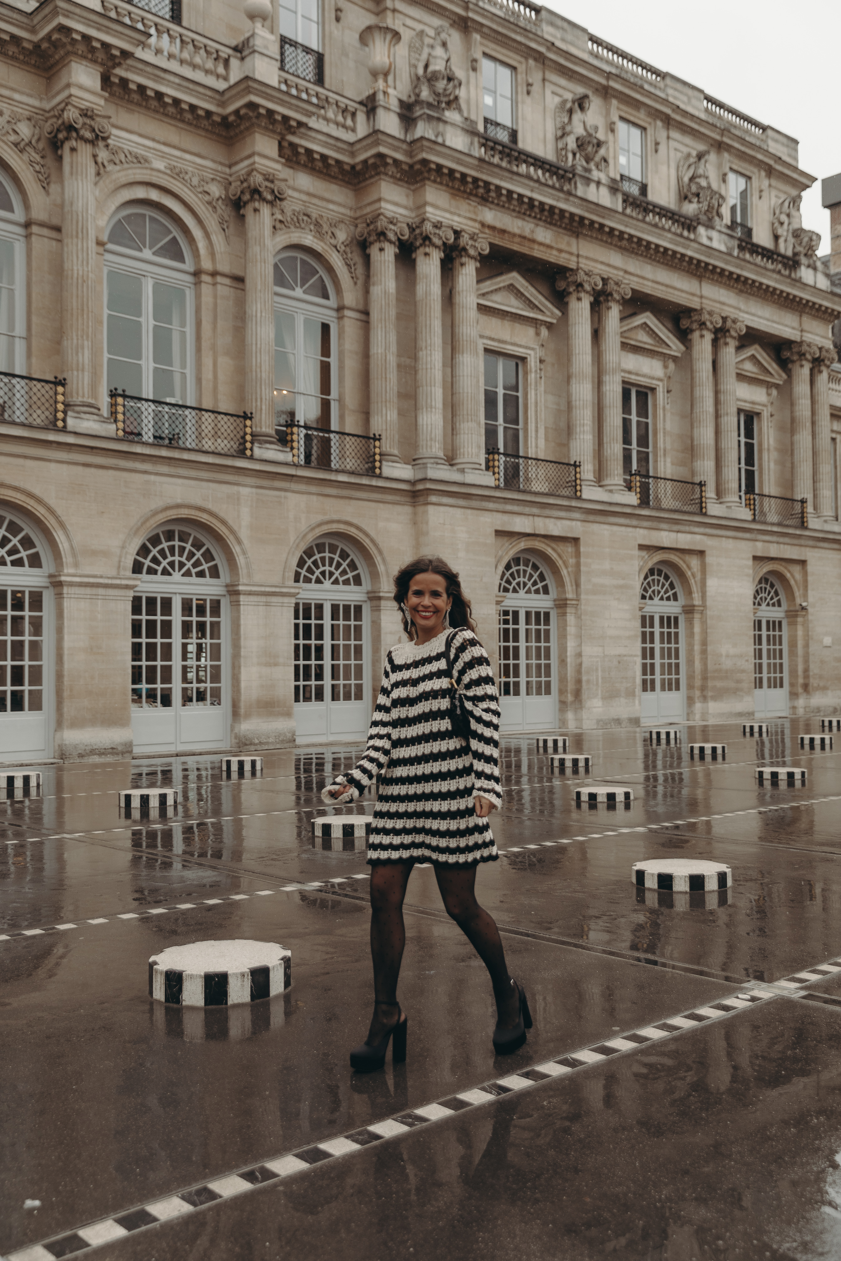 Sara from Collage Vintage at Paris Fashion Week. Wearing a striped knit long sweater, Fendi vintage bag and platform sandals.