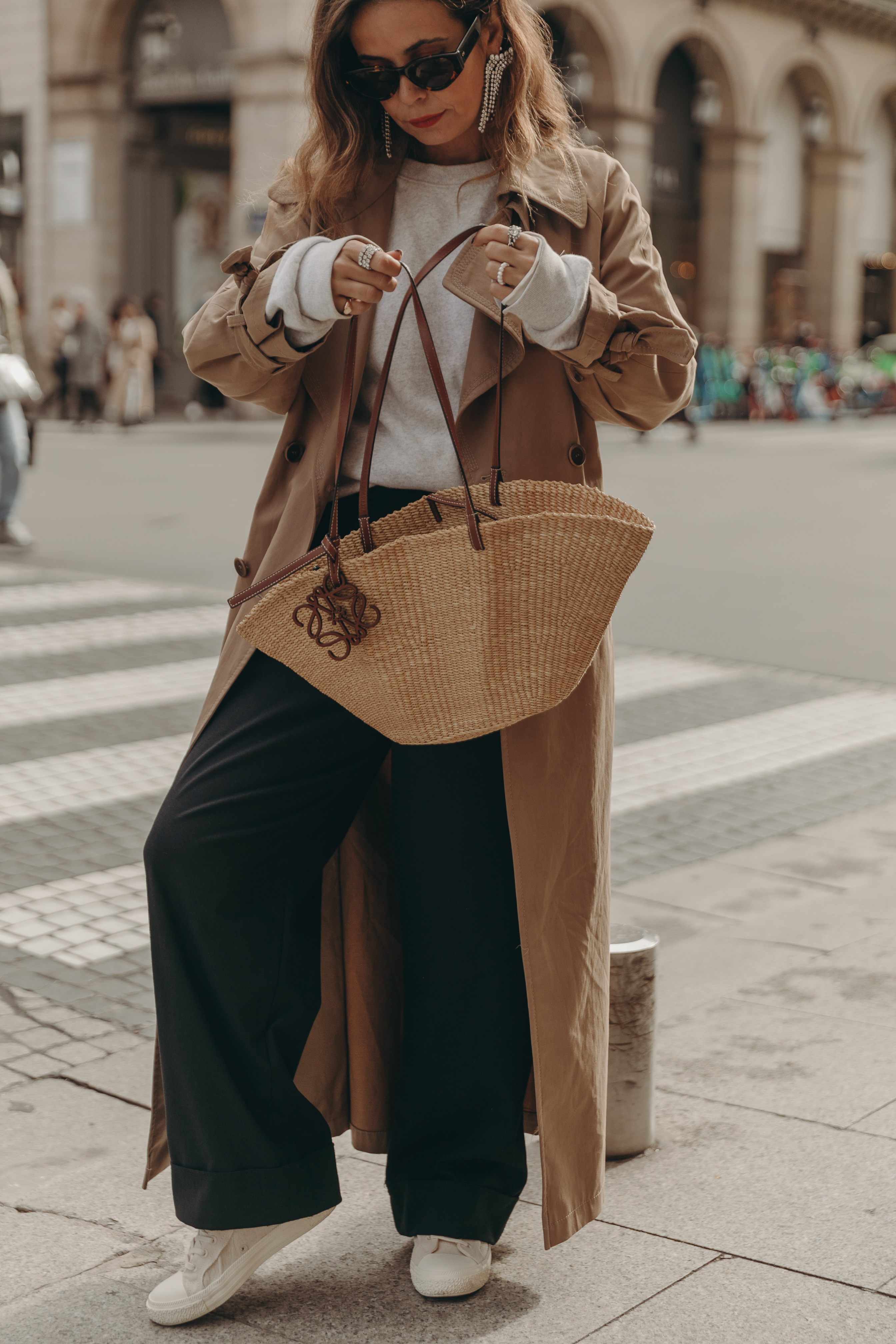 Casual look wearing trench coat, sweatshirt and sneakers. Collage Vintage at Paris Fashion Week.