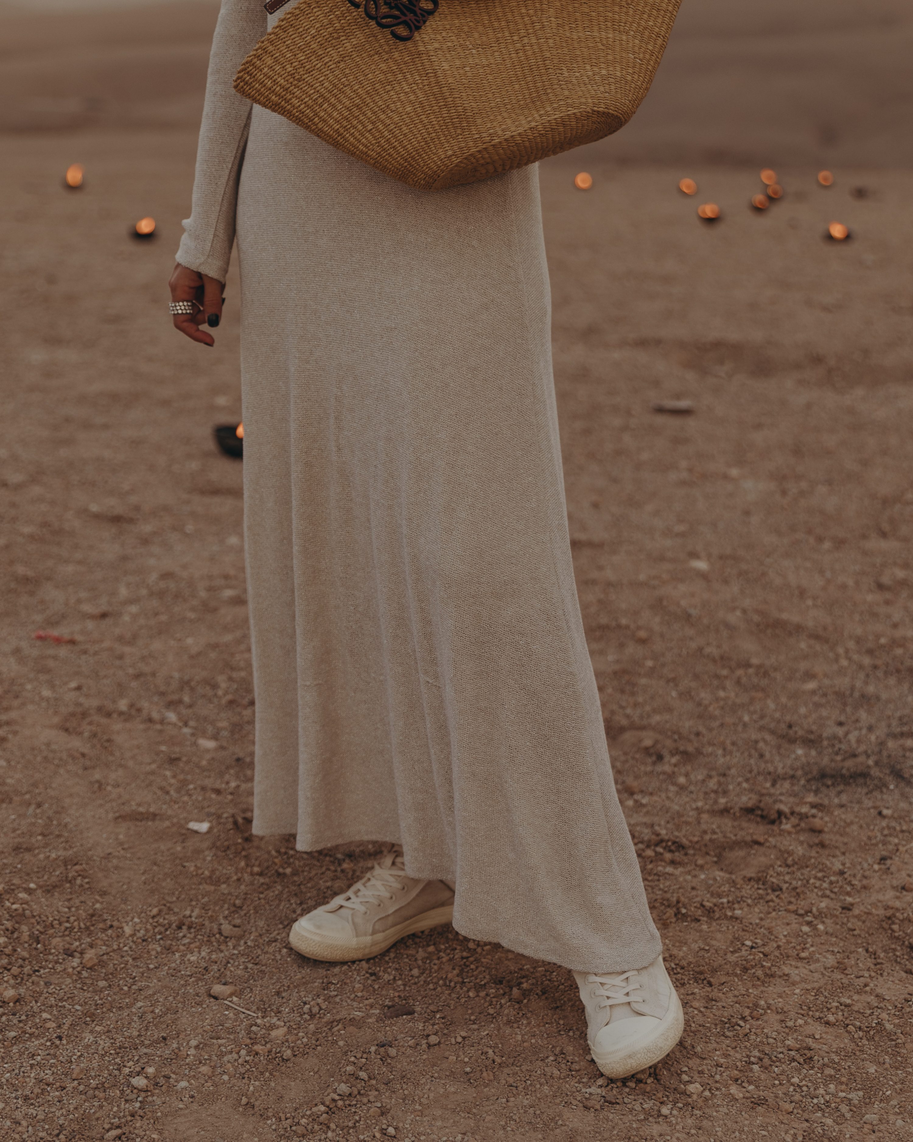 Sara from Collage Vintage wearing a Knit maxi dress, Loewe seashell basket bag and Chanel vintage earrings